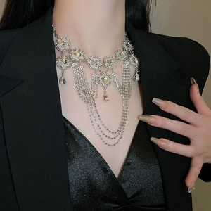 Close-up of luxury tiered tassel necklace with rhinestones and crystal teardrop pendants