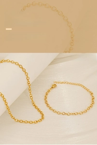 Detail of 18K gold-plated stainless steel link chain necklace and bracelet set
