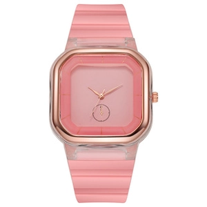 Detail of pink square quartz watch with transparent case and rose gold accents