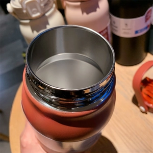 Macro shot of wide mouth stainless steel insulated bottle for easy cleaning and filling