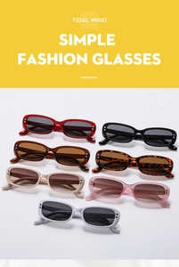 Flat lay of retro oval sunglasses in seven colors with metallic accents and TIDAL WIND text