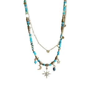 Vintage star and moon necklace with teal crystal beads and celestial charms in gold tone