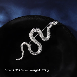 Detailed view of silver snake brooch with scale texture showing dimensions 2.9x7.3cm