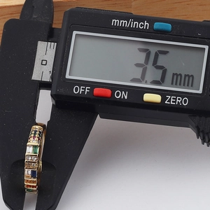 Detailed macro view showing the 3.5mm width of a gold rainbow crystal eternity ring