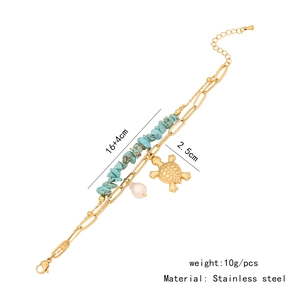 Macro detail of stainless steel beach bracelet with turquoise beads and sea turtle charm