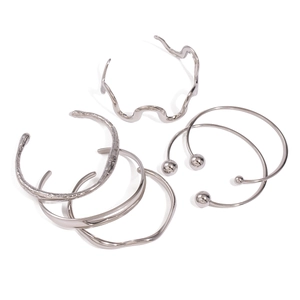 Irregular silver stainless steel cuff bracelet set with textured waves and ball ends