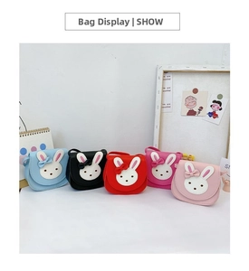 Detailed view of five colorful rabbit cartoon shoulder bags for girls in PU leather material