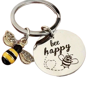 Stainless steel Bee Happy keychain with rhinestone bee charm on white background