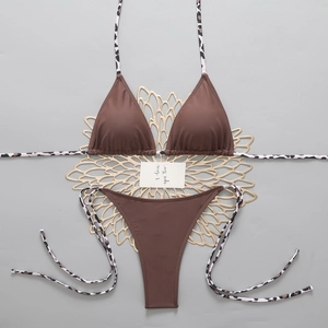 Brown bikini set with leopard print ties and triangle cups on a gray background