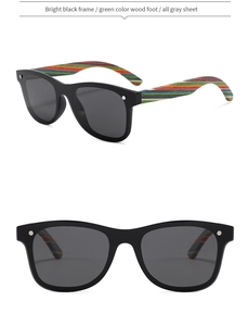 Detail view of polarized sunglasses with bright black frames and wooden temples