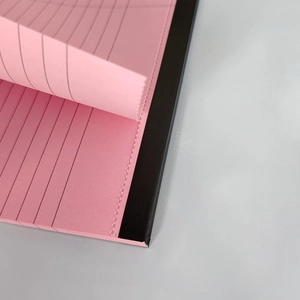 Pink A5 lined notepad with black top binding and easy-tear perforated pages
