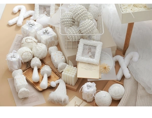 Detailed set of white Christmas ornaments featuring pearls, mini gift boxes and candy canes