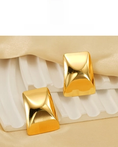Macro detail of 18K gold plated rectangular earrings featuring a high-polished mirror finish