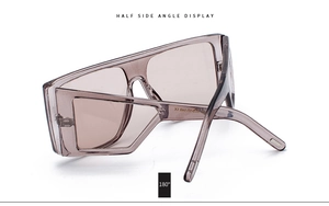 Side angle view of retro oversized square sunglasses with translucent grey frames