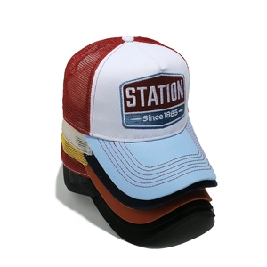 Summer mesh trucker hat with letter embroidery shown in multiple colors on white background