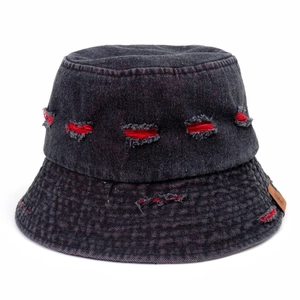 Close-up of distressed black denim bucket hat with red frayed holes and leather patch
