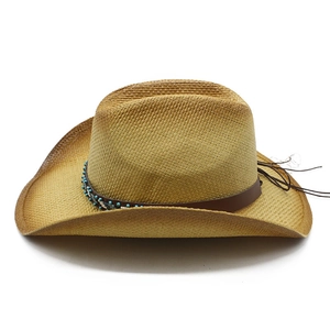 Western style straw cowboy hat with beaded band and curved brim for beach sun protection