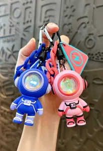 Creative LED astronaut keychains in pink and blue PVC material