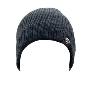 Close-up of thick dark grey ribbed knit beanie with small snowflake logo label detail