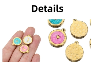 Detail of round enamel pendants with gold moon and heart patterns on hammered metal
