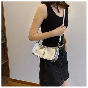 Chic silver metallic shoulder bag shown on model for a stylish lifestyle fashion look