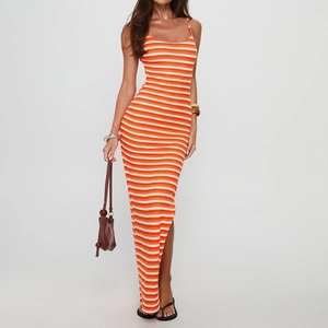Detail of orange and white striped knitted maxi dress showing side slit and fabric texture