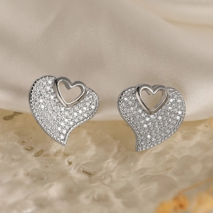 Sparkling silver heart-shaped stud earrings with full pavé crystals and cutout design