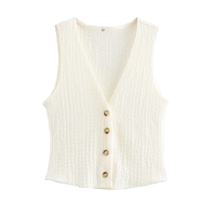 Detail of cream sleeveless textured vest showing V-neck and size XS label on fabric