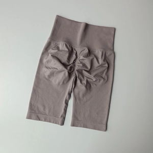 Detail of grey-purple seamless high-waist yoga shorts with scrunch butt lifting texture