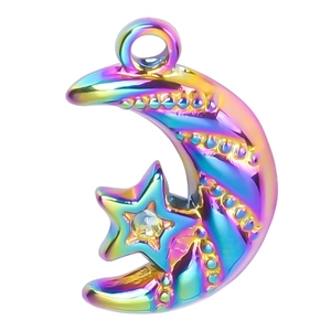 Macro detail of rainbow plated stainless steel moon and star charm for jewelry DIY