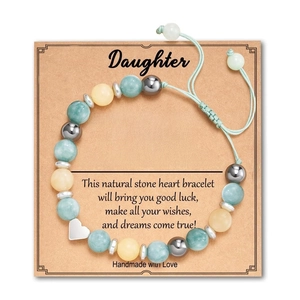 Detailed view of handmade natural stone heart bracelet for daughter on greeting card