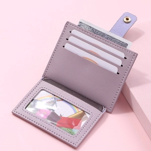 Detail view of lavender faux leather card holder with three slots and photo window