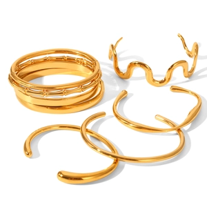 Polished 18K gold plated stainless steel bangles set featuring textured and sleek designs