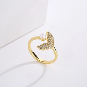 Macro view of 18K gold plated moon ring with micro-set zircons and a lustrous pearl