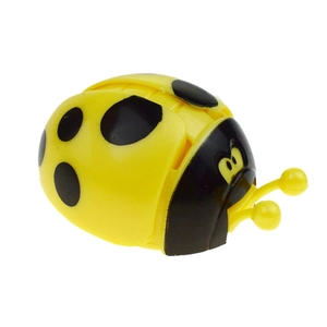 Wind-up yellow ladybug toy with spreading wings and black spots for children