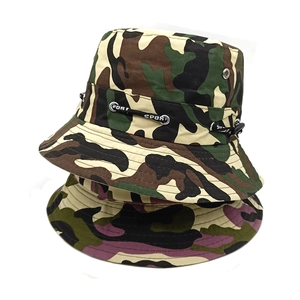 Detail of camouflage bucket hats showing metal eyelets and adjustable Sport drawstrings