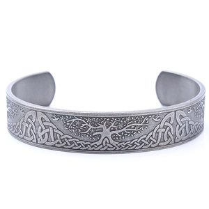 Detailed relief of Celtic Tree of Life on vintage silver mesh stainless steel cuff bracelet