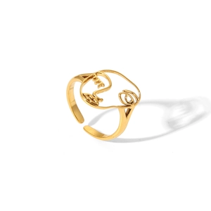 Bague ouverte dorée artistique avec un design de visage abstrait minimaliste poli