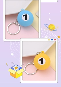 Detail of creative blue and yellow billiard ball number 1 keychains with silver rings