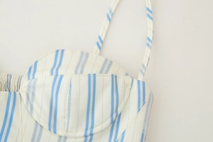 Close-up of blue vertical stripes and adjustable spaghetti straps on crop top
