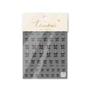 Stickers nail art 3D gaufrés avec motifs de têtes de mort et cœurs colorés sur fond blanc