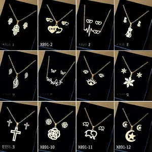 Collection of twelve gold stainless steel jewelry sets with hamsa, heart, and animal motifs