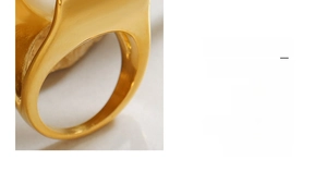 Detailed macro view showing the polished 18k gold finish and thick metal band texture