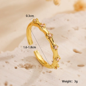 Macro view of 18K gold plated ring with pink zircon and measurement specifications