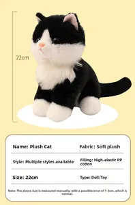 Detail of 22cm seated tuxedo cat plush toy showing soft fabric and height measurement