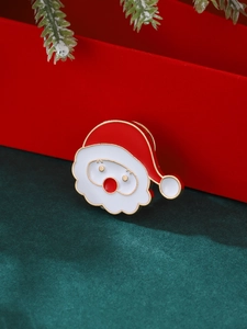 Broche Père Noël en émail avec bordure dorée pour les tenues de Noël