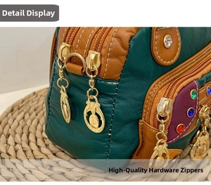 Detail of colorful patchwork leather bag with golden hardware and gemstone accents