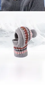 Detail of grey winter knit integrated hat showing warm fleece lining and pom-pom