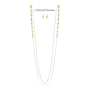Detail of 70cm gold-plated glasses chain featuring delicate metal cross charms