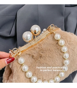 Detail of plush faux fur handbag with elegant large pearl clasp and golden hardware